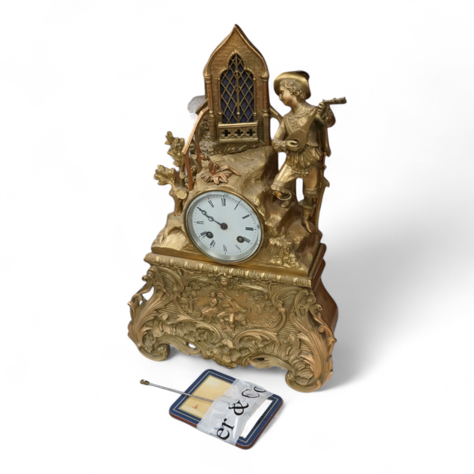 A late 19th century French gilt bronze mantel clock, with figural surmount, 42.5cm high.